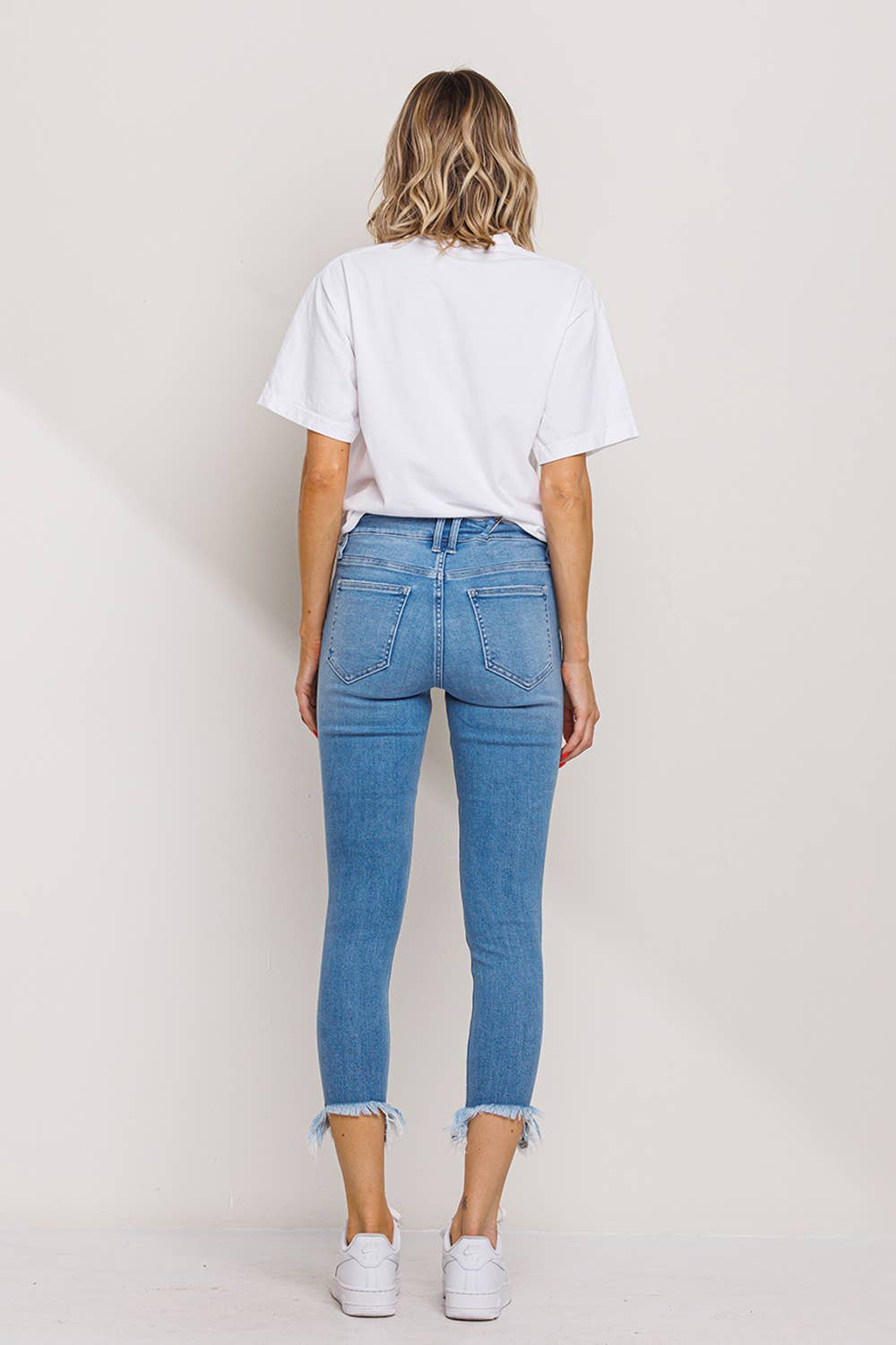 "Fiona" Mid Rise Chew Hem Skinny: Light Denim