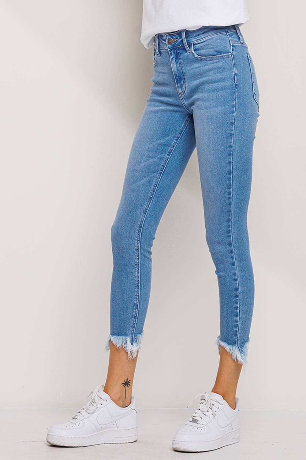 "Fiona" Mid Rise Chew Hem Skinny: Light Denim