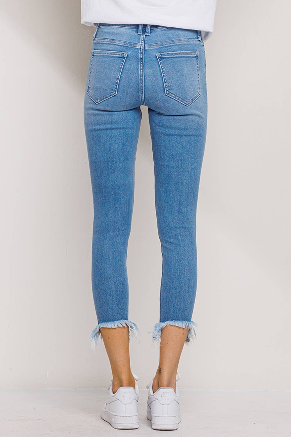 "Fiona" Mid Rise Chew Hem Skinny: Light Denim