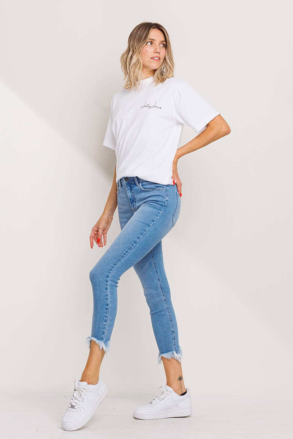 "Fiona" Mid Rise Chew Hem Skinny: Light Denim