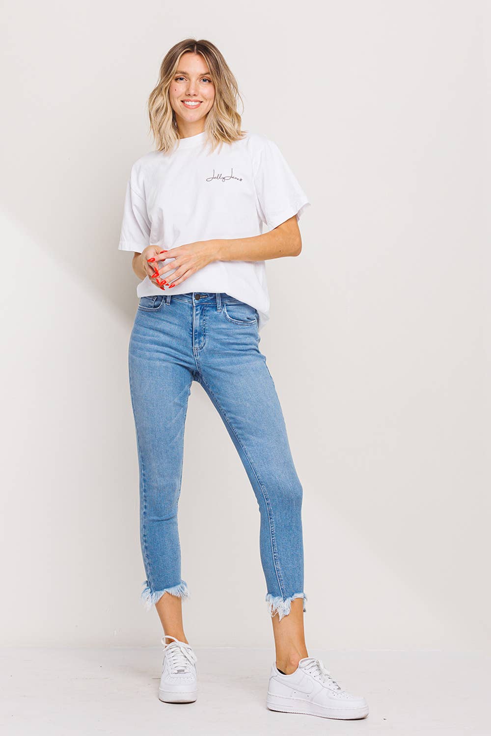 "Fiona" Mid Rise Chew Hem Skinny: Light Denim